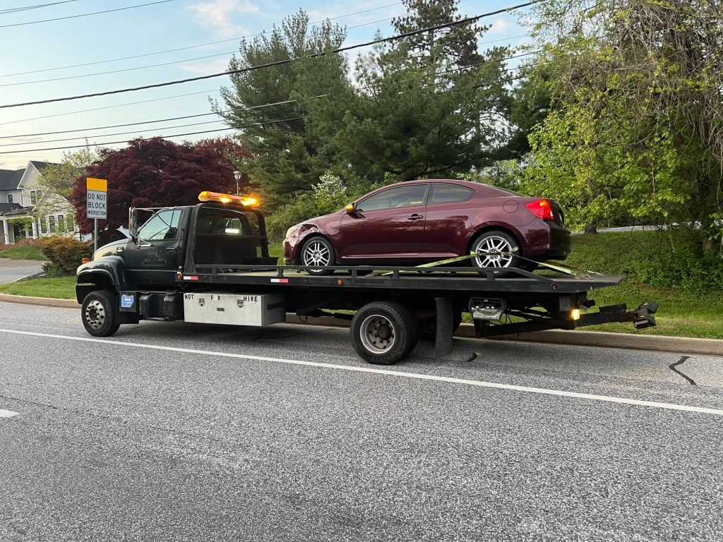 IGW Towing towing car with missing wheel?
