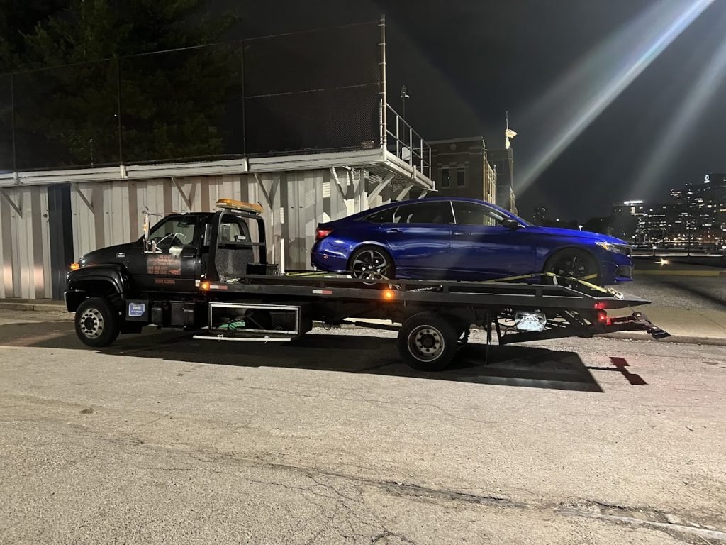 I got whipz towing & roadside assistance with a Blue Honda towing near me at 1020 Hull st Baltimore,MD 21230