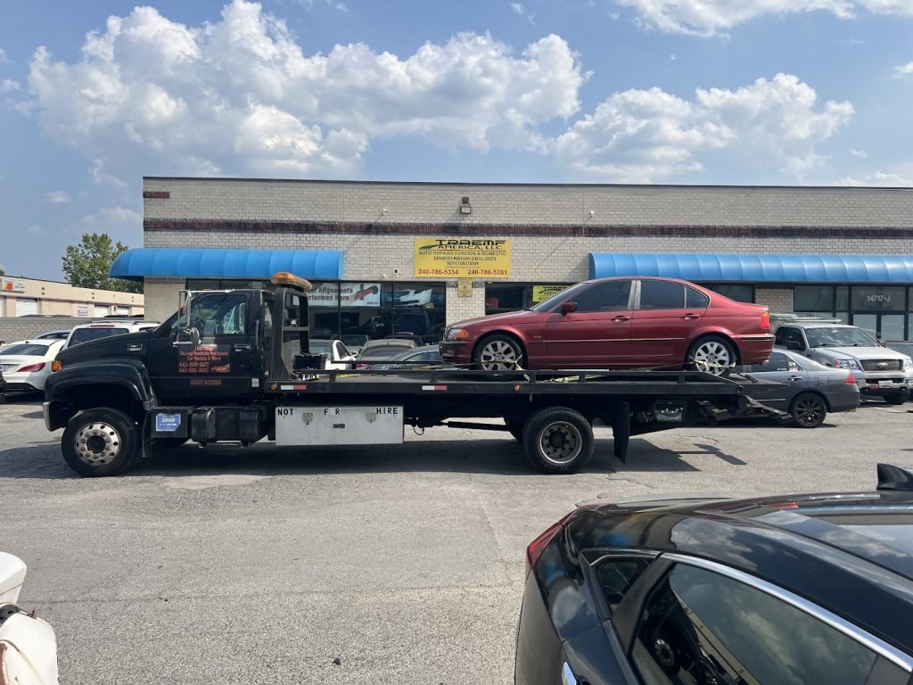 I got Whipz Towing & Roadside Assistance with a red bmw towing near me from 3600 St.Johns Ln Ellicott City,MD 21042 to Laurel,MD