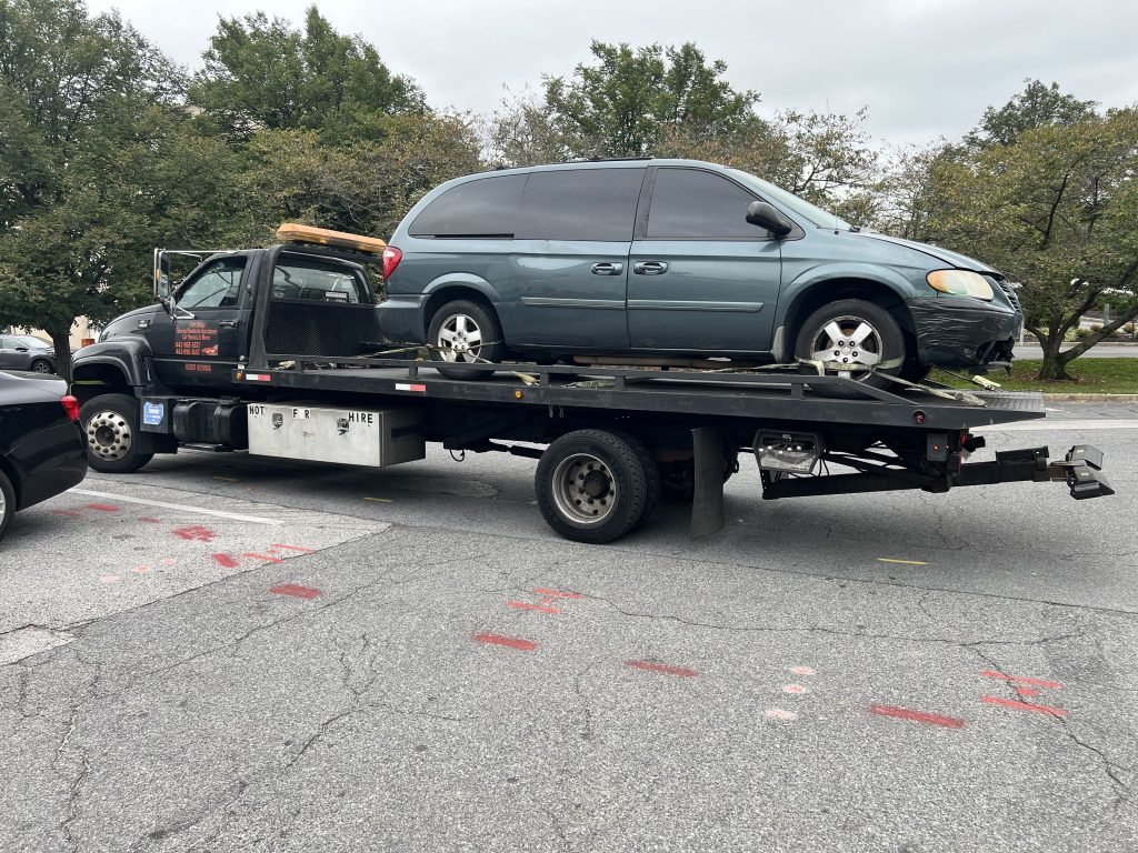 I got Whipz Towing & Roadside Assistance with a green dodge caravan towing near me from 1800 Belmont Windsor Mill, MD 21244 to 3700 Arcadia Baltimore, MD 21215