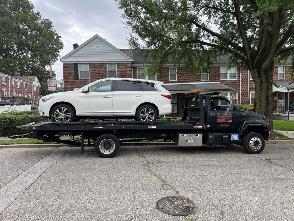 I got Whipz Towing & Roadside Assistance with a infiniti J30 towing near me from 2600 Gwynn Falls Pkwy Baltimore, MD 21216 to 700 Cator Ave Baltimore, MD 21218