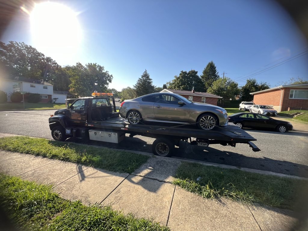 I got Whipz Towing & Roadside Assistance with a gray Infiniti g37 Coupe towing near me from 3400 Washington ave Windsor Mill, MD 21244 to 8400 Baltimore National Pike Catonsville, MD 21043