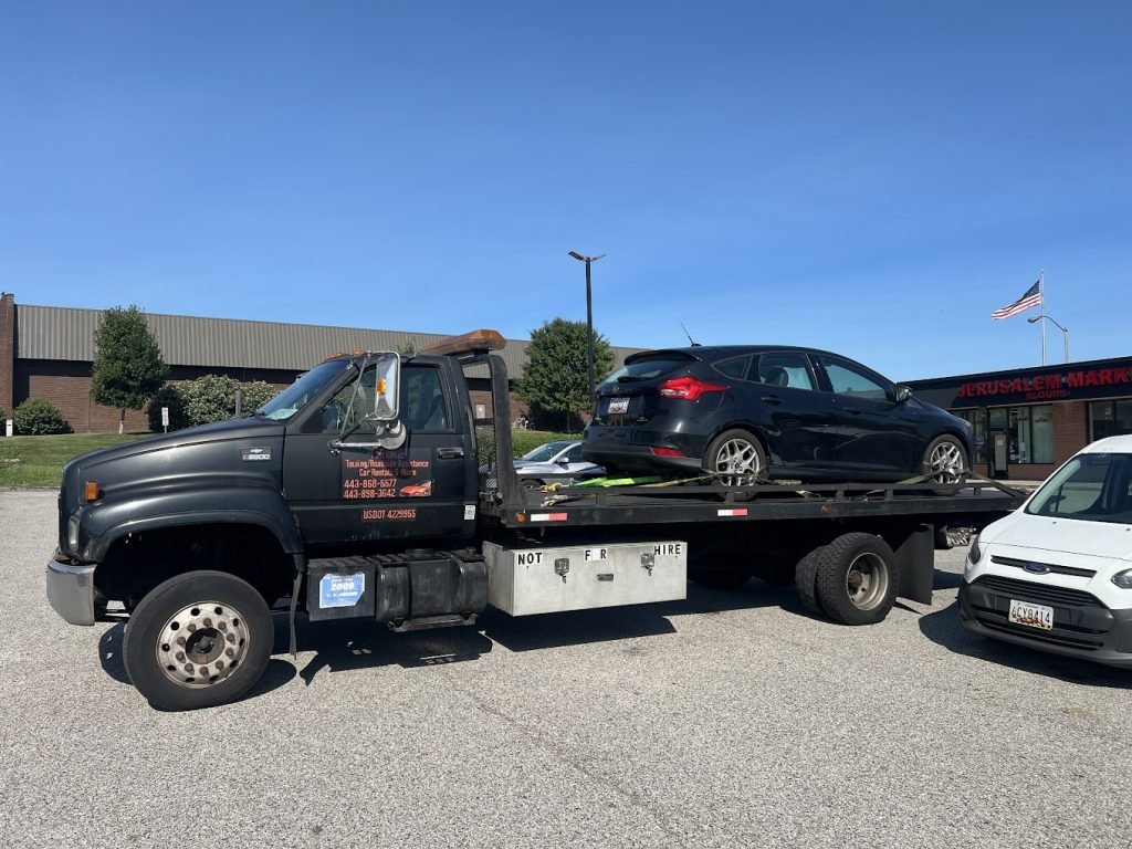 I got Whipz Towing & Roadside Assistance with a blk ford fusion towing near me from 2015 Lord Baltimore Windsor Mill,MD 21244 to W. Belvedere 21215
