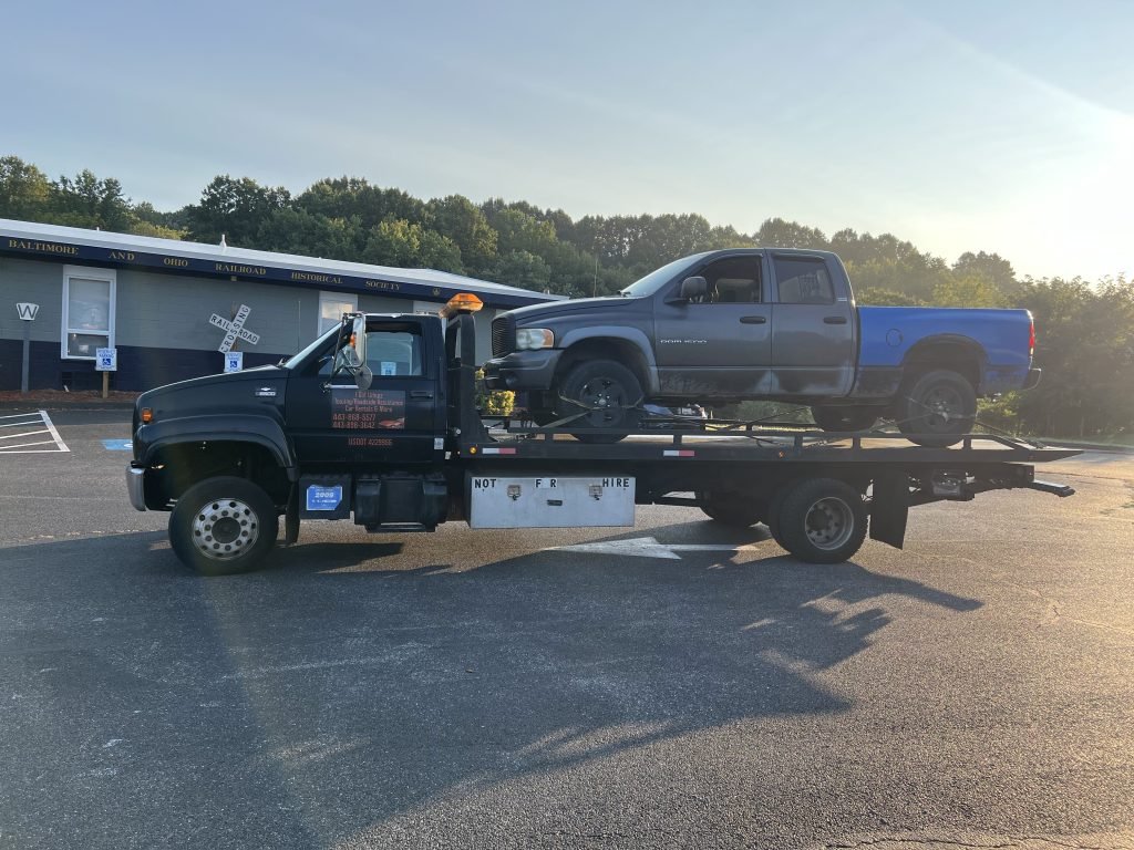 I got Whipz Towing & Roadside Assistance with a gry Ram 1500 towing near me from 70-W Ellicott City, MD 21041 to Sykesville, MD 21784