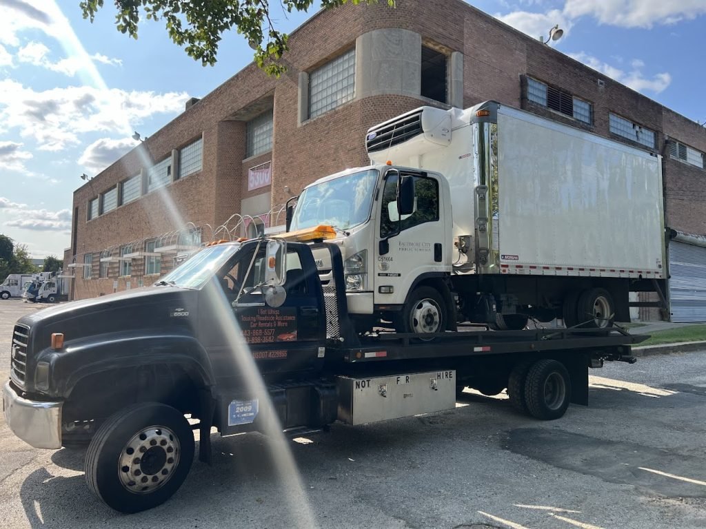 I got Whipz Towing & Roadside Assistance with a isuzu refeer box truck towing near me from 5300 Pulaski Hwy Baltimore,MD 21205 to 7000 Pulaski Highway Baltimore, MD 21205