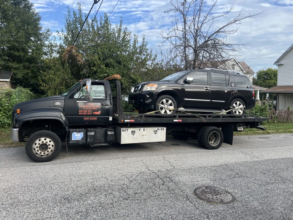 I got Whipz Towing & Roadside Assistance with a blk Nissan Armata towing near me from 3100 Benson Ave Baltimore, MD 21223 to 2000 Harlem Ave Baltimore, MD 21217