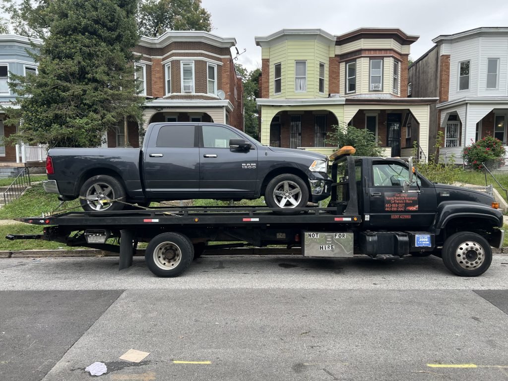 I got Whipz Towing & Roadside Assistance with a grey Ram 1500 towing near me from 2200 Mt Holly St Baltimore, MD 21216 to 5200 Linden Heights Baltimore, MD 21215