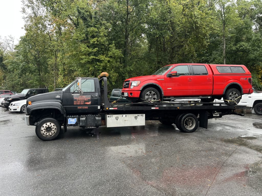 I got Whipz Towing & Roadside Assistance with a red F-150 towing near me from 700 Kahn dr Pikesville, MD 21208 to 4400 Milford Mill rd Pikesville,MD 21208