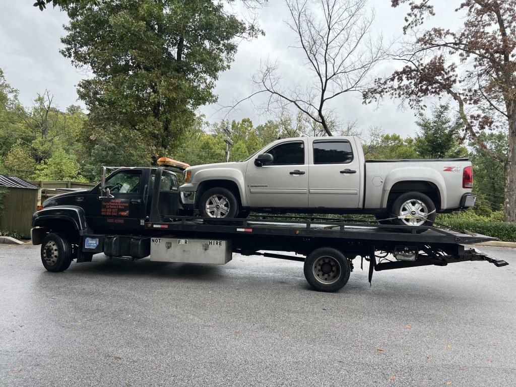 I got Whipz Towing & Roadside Assistance with a gold GMC Sierra towing near me from 1 Torlina Ct Woodlawn,MD 21207 to 1000 Cummings ave Catonsville,MD 21228