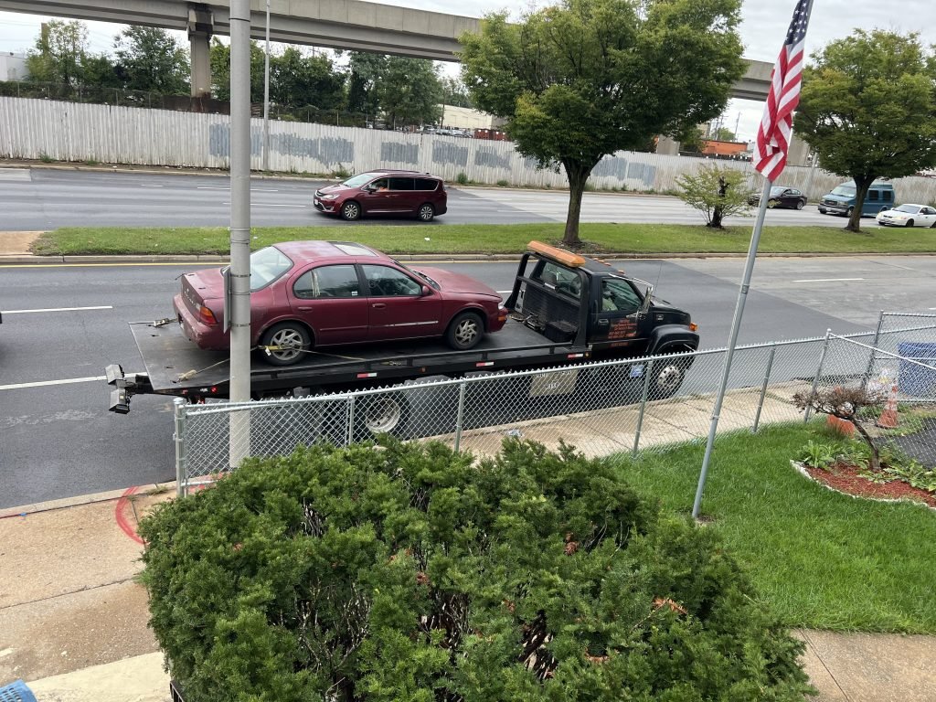 I got Whipz Towing & Roadside Assistance with a red nissan maxima towing near me from I-70 E to 4000 Montana Ave Baltimore, MD 21206