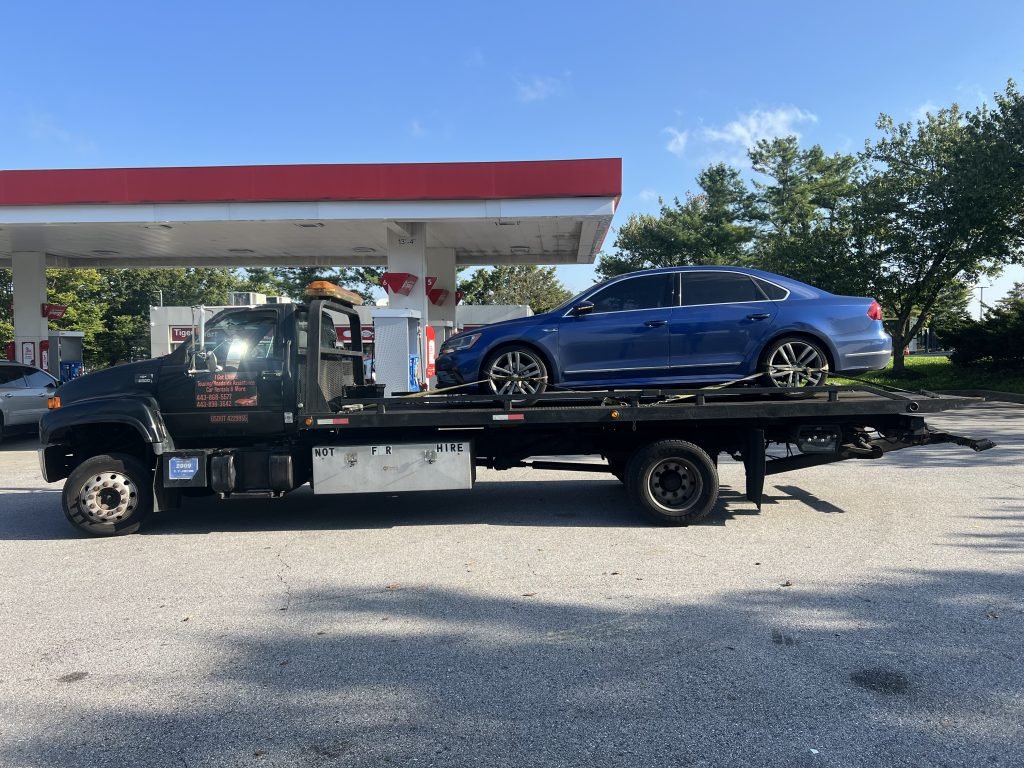 I got Whipz Towing & Roadside Assistance with a blue Volkswagen Passat towing near me from 1600 Belmont Ave Windsor Mill, MD to 7000 Paris rd Lochearn, MD 21207
