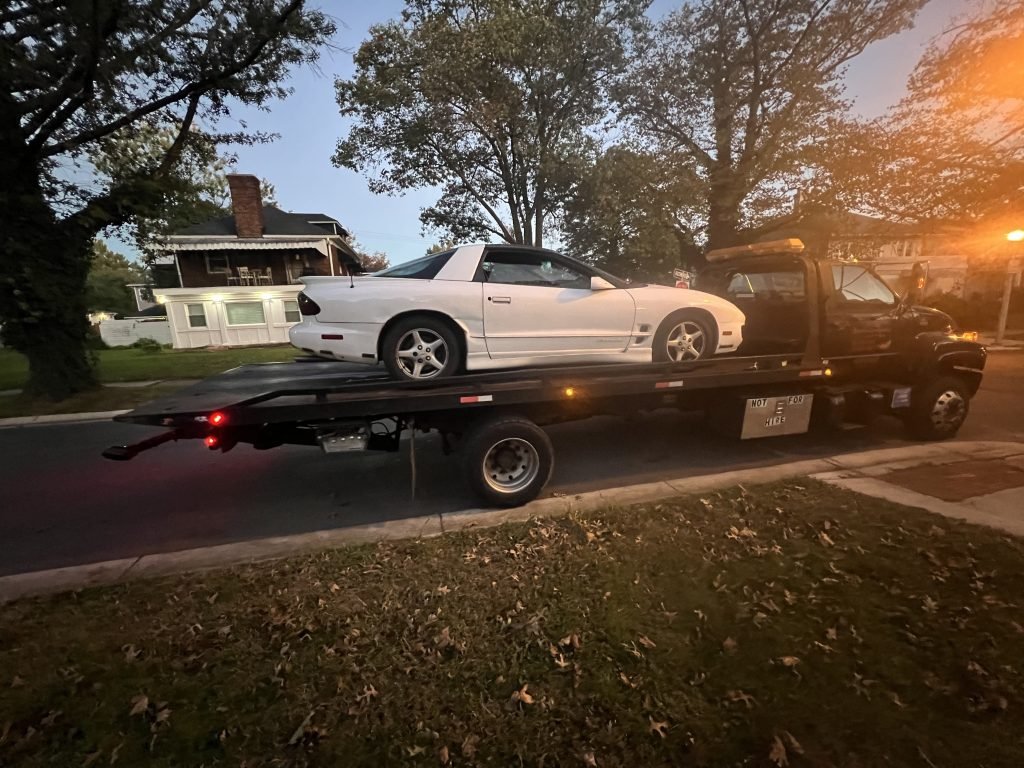 I got Whipz Towing & Roadside Assistance with a white pontiac firebird towing near me from 8200 washington blvd Jessup, MD 20794 to 3400 cedardale rd Baltimore, MD 21216