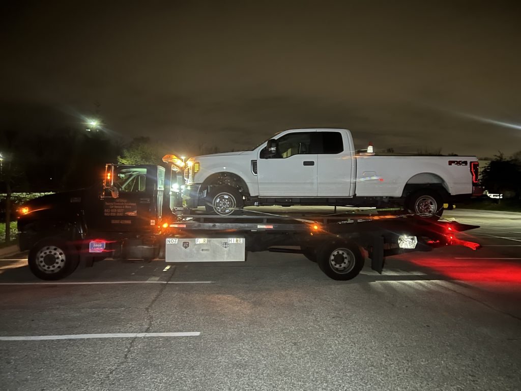 I got Whipz Towing & Roadside Assistance with a white ford F-250 towing near me from 7700 Windsor Mill rd Windsor Mill, MD 21244 to 6970 Security Blvd Baltimore, MD 21244