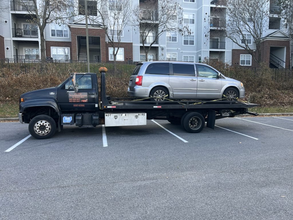 I got Whipz Towing & Roadside Assistance with a silver chrysler van towing near me from 10000 redrun blvd owings mills, MD 21117 to 7 cedarmere owings mills, MD 21117