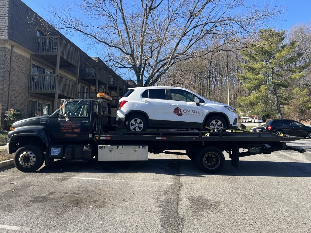 I got Whipz Towing & Roadside Assistance with a white chevy traverse towing near me from 1700 champlain dr Gwynn Oak, MD 21207 to 1700 ingleside ave gwynn oak, MD 21207