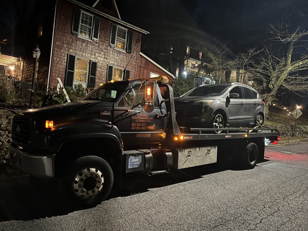 I got Whipz Towing & Roadside Assistance with a grey ford escape towing near me from 5000 Wetheredsville Rd Milford Mill, MD 21244