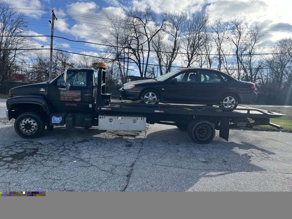 I got Whipz Towing & Roadside Assistance with a black ford taurus towing near me from 3100 Windsor Blvd Lochearn, MD 21207 to 6677 Reiserstown rd Baltimore, MD 21215