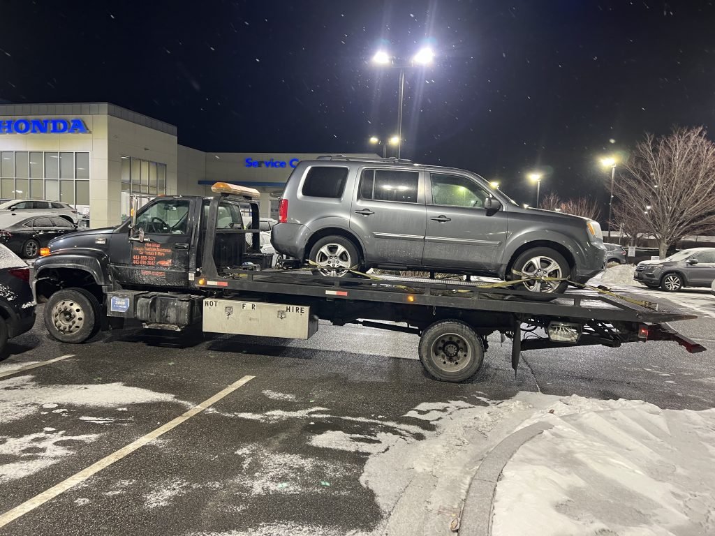 I got Whipz Towing & Roadside Assistance with a grey Honda Pilot towing near me from 6900 Dogwood rd Woodlawn, MD 21244 to 9700 Reiserstown rd Owings Mills, MD 21117