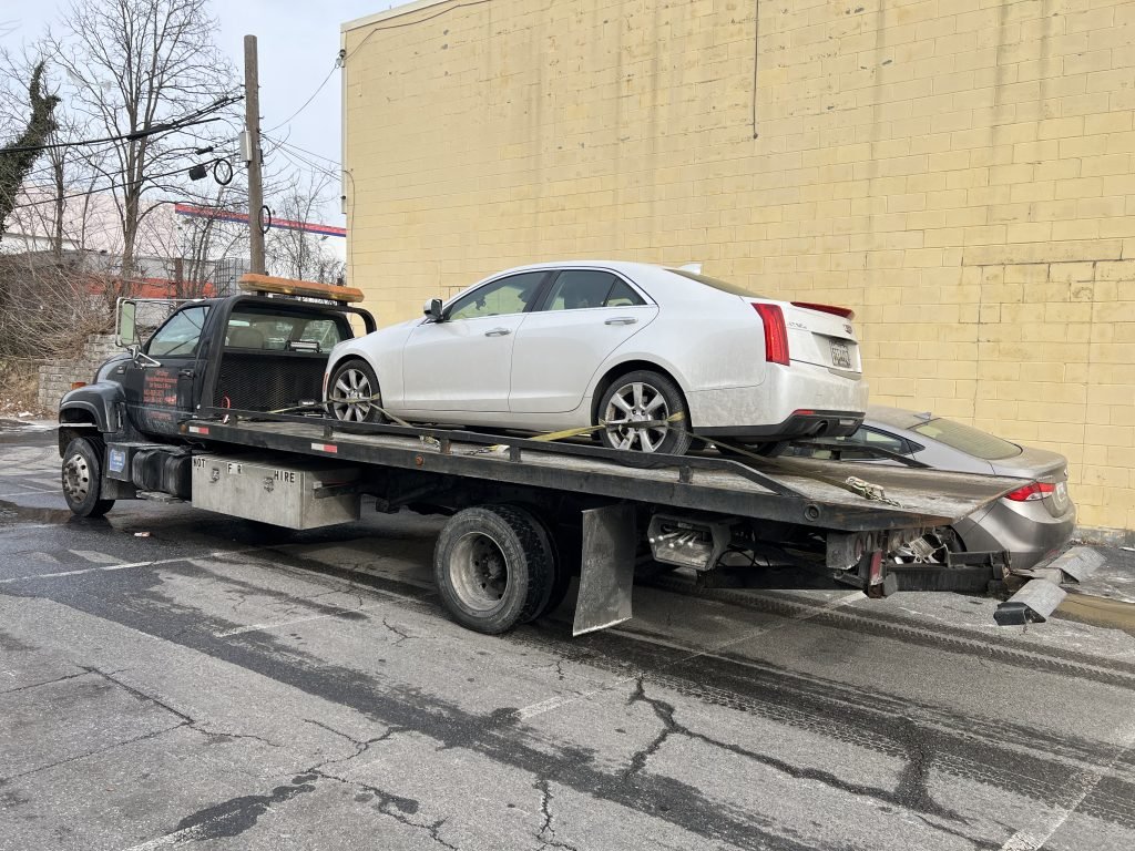 I got Whipz Towing & Roadside Assistance with a white cadillac cts towing near me from 2000 N forest park ave Baltimore, MD 21207 to 6212 Baltimore National Pike Catonsville, MD 21228
