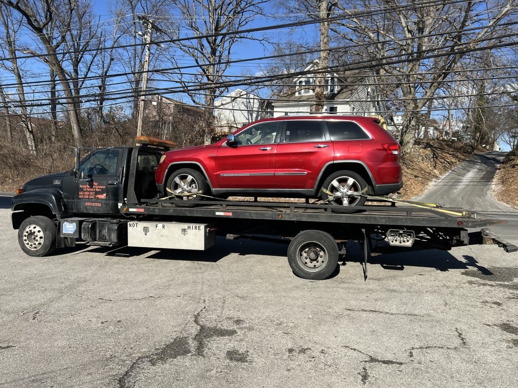 I got Whipz Towing & Roadside Assistance with a red Jeep Cherokee towing near me from 6725 Dogwood rd Woodlawn MD 21207 to 3700 Pikewood Dr Randallstown, MD 21133