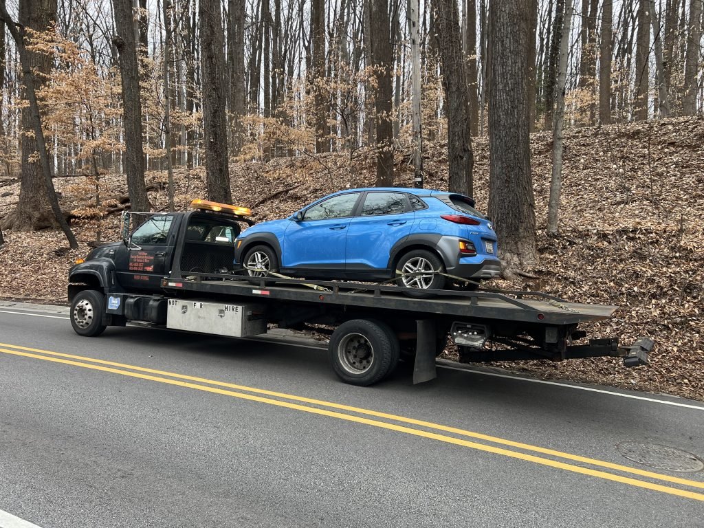 I got Whipz Towing & Roadside Assistance with a blue Toyota Prius towing near me from 4900 Windsor Mill rd Gwynn Oak, MD 21207 to 1017 leslie ave Woodlawn, MD 21228