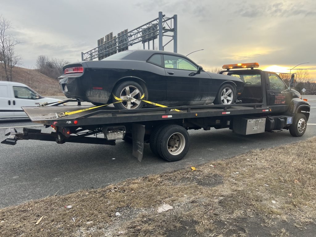 I got Whipz Towing & Roadside Assistance with a blk dodge challenger towing near me from I-695 exit 12A to 6700 Dogwood rd Woodlawn, MD 21207