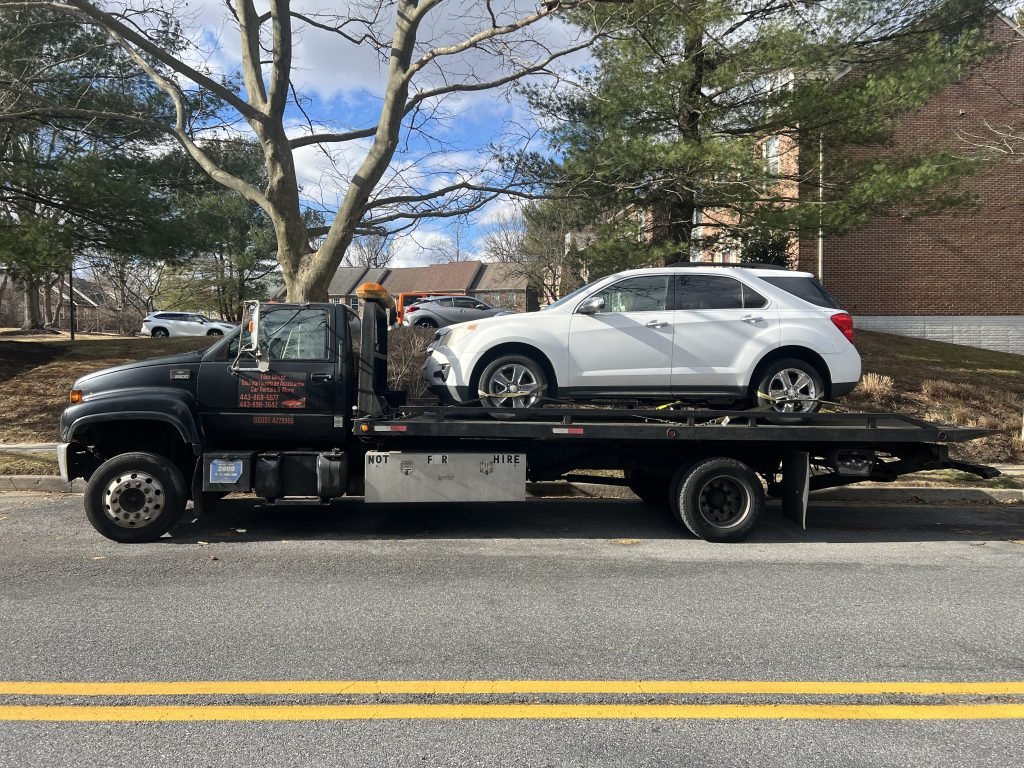I got Whipz Towing & Roadside Assistance with a white chevy equinox towing near me from 8000 Valley Manor Garrison, MD 21117 to 7600 harford rd Baltimore, MD 21234