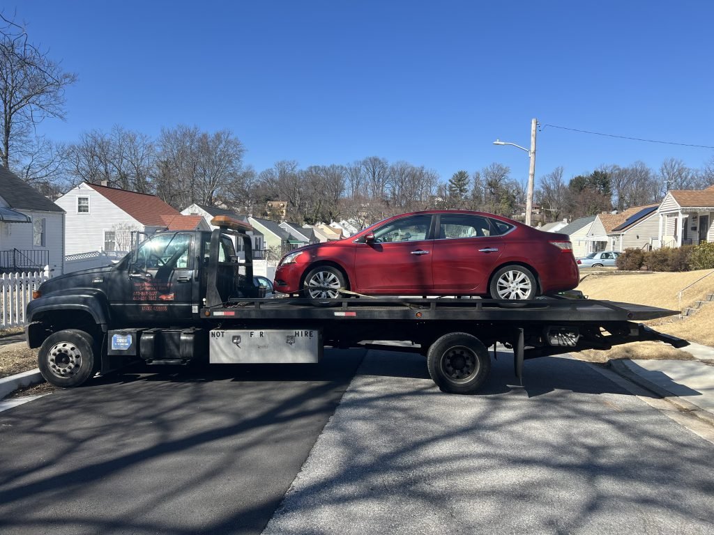 I got Whipz Towing & Roadside Assistance with a red nissan sentra towing near me from 5400 Lewellen ave Lochearn, MD 21207 to 1701 woodlawn dr Gwynn oak, MD 21207