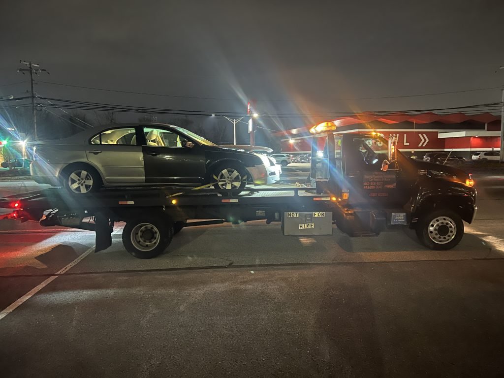 I got Whipz Towing & Roadside Assistance with a silver ford fusion towing near me from 1717 n rolling rd Baltimore, MD 21244 to 7501 tudsbury rd milford mill, MD 21244