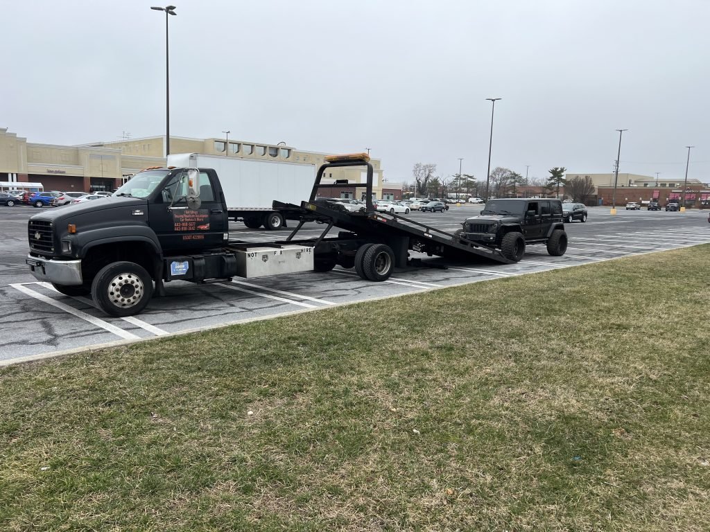 I got Whipz Towing & Roadside Assistance with a black jeep Wrangler towing near me from 6620 Reiserstown rd Baltimore, MD 21215 to 3300 Old Court rd Pikesville, MD 21208