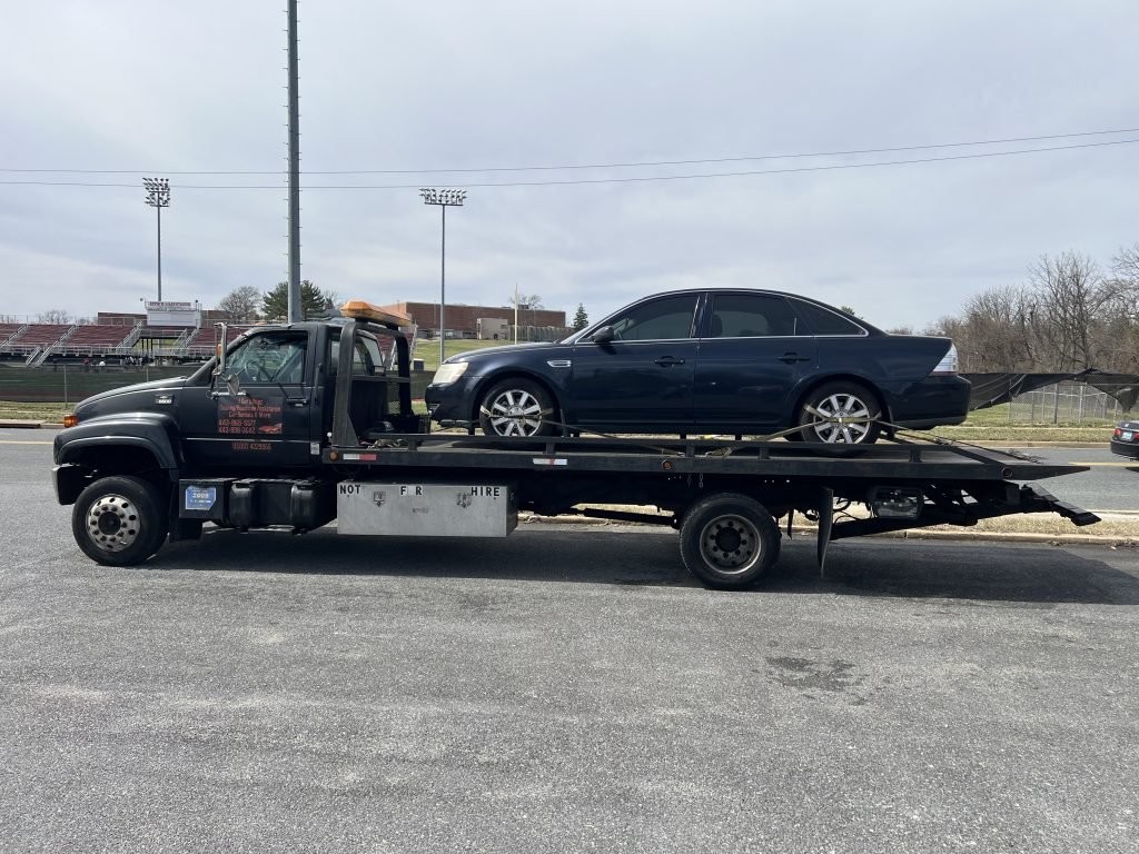 I got Whipz Towing & Roadside Assistance with a blue ford 500 towing near me from 1801 gwynn oak ave Woodlawn, MD 21207 to 6878 Townbrook dr Lochearn, MD 21207