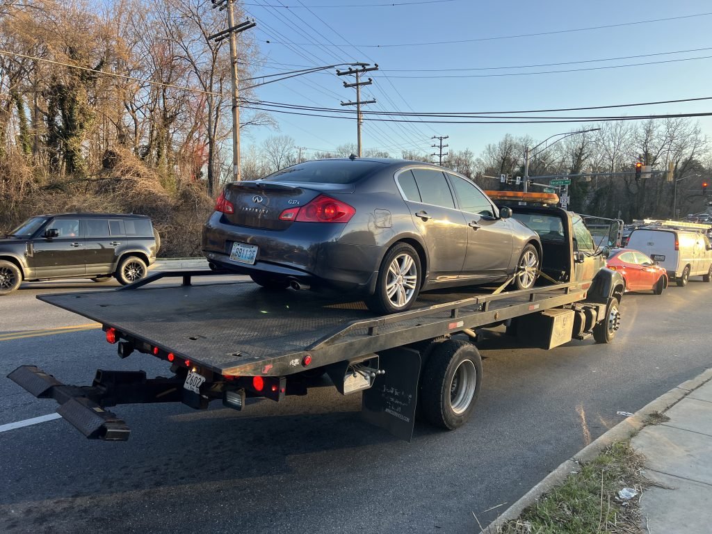 I got Whipz Towing & Roadside Assistance with a blue infiniti g35 towing near me from 1625 ingleside ave Woodlawn, MD 21207 to 5304 dogwood rd Woodlawn, MD 21207