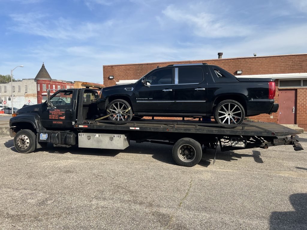 I got Whipz Towing & Roadside Assistance with a black Cadillac Escalade towing near me from 2300 reisterstown road baltimore, MD 21217 to 3600 Callaway Avenue, Baltimore, MD 21215