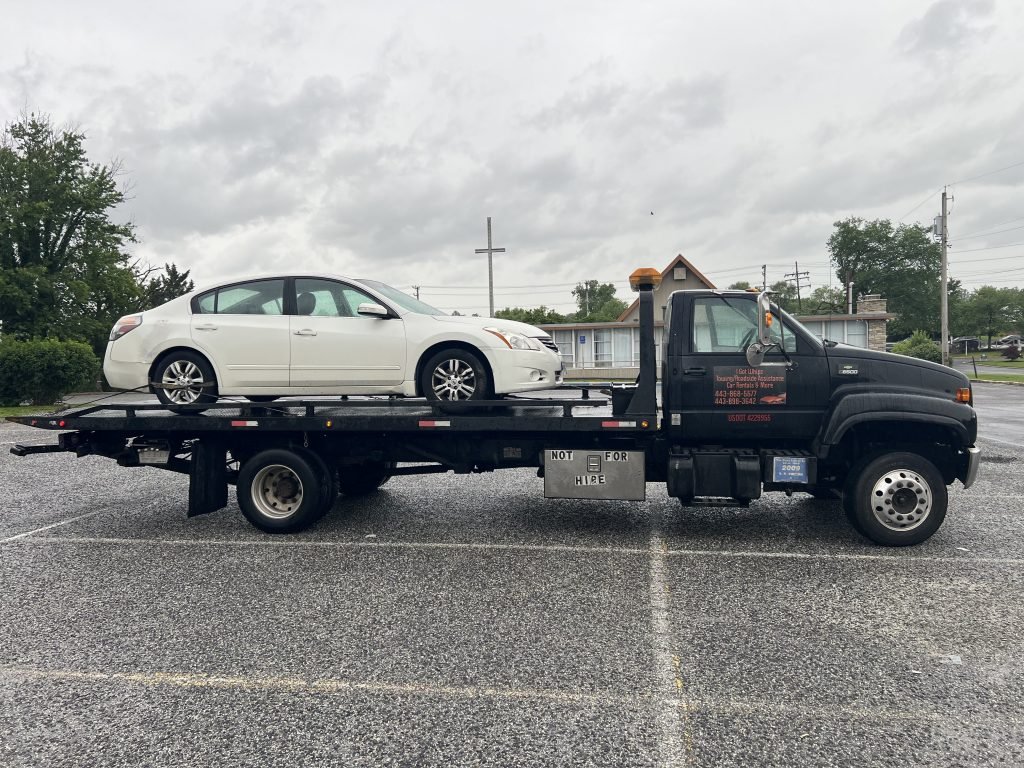 I got Whipz Towing & Roadside Assistance with a white Nissan Altima towing near me from 1003 Vanderwood rd Catonsville, MD 21228 to 7024 rockridge Rd, lochearn, MD 21207