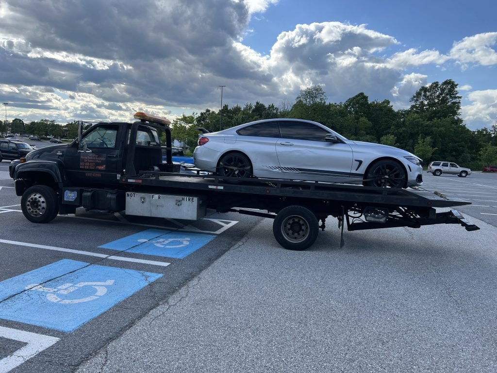 I got Whipz Towing & Roadside Assistance with a silver bmw m series coupe towing near me from 6675 Marie Curie Dr, Elkridge, MD 21075 to 6700 Baltimore National Pike, Baltimore, MD 21228