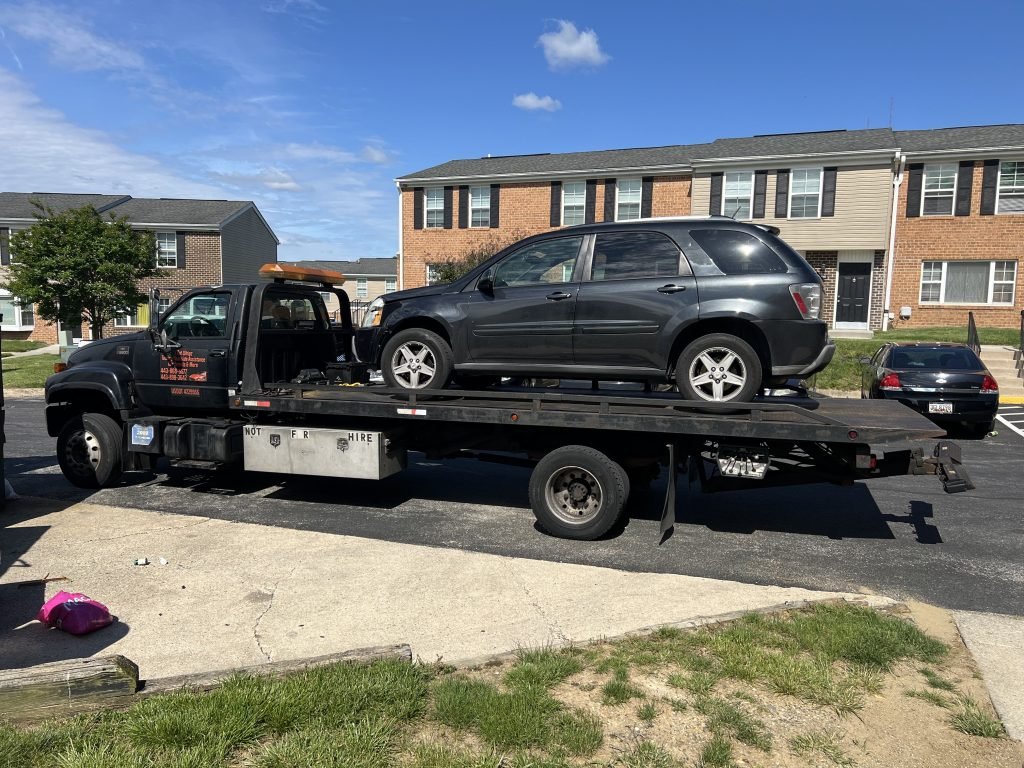 I got Whipz Towing & Roadside Assistance with a blk chevy suv towing near me from 7255 Sawmill Branch Rd, Windsor Mill, MD 21244 to 2601 Rolling Rd. Suite 106, Windsor Mill, MD 21244
