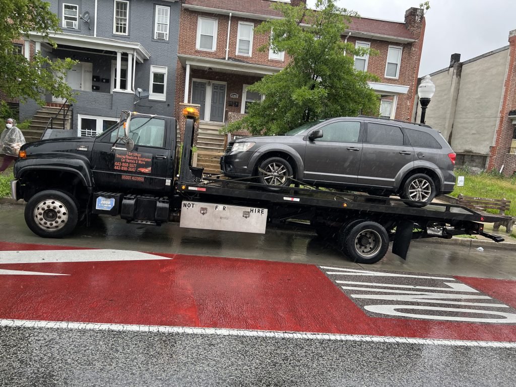 I got Whipz Towing & Roadside Assistance with a grey dodge journey suv towing near me from 3046 W North Ave, Baltimore, MD 21216 to 6610 Baltimore National Pike, Woodlawn, MD 21228