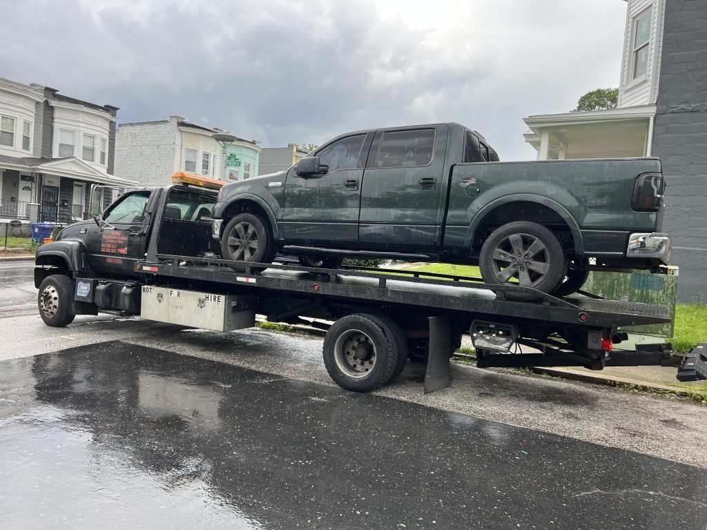 I got Whipz Towing & Roadside Assistance with a green Ford F150 truck towing near me from 4100 Frisby St, Baltimore, MD 21218 to 7201 Portage Ave, Baltimore, MD 21239