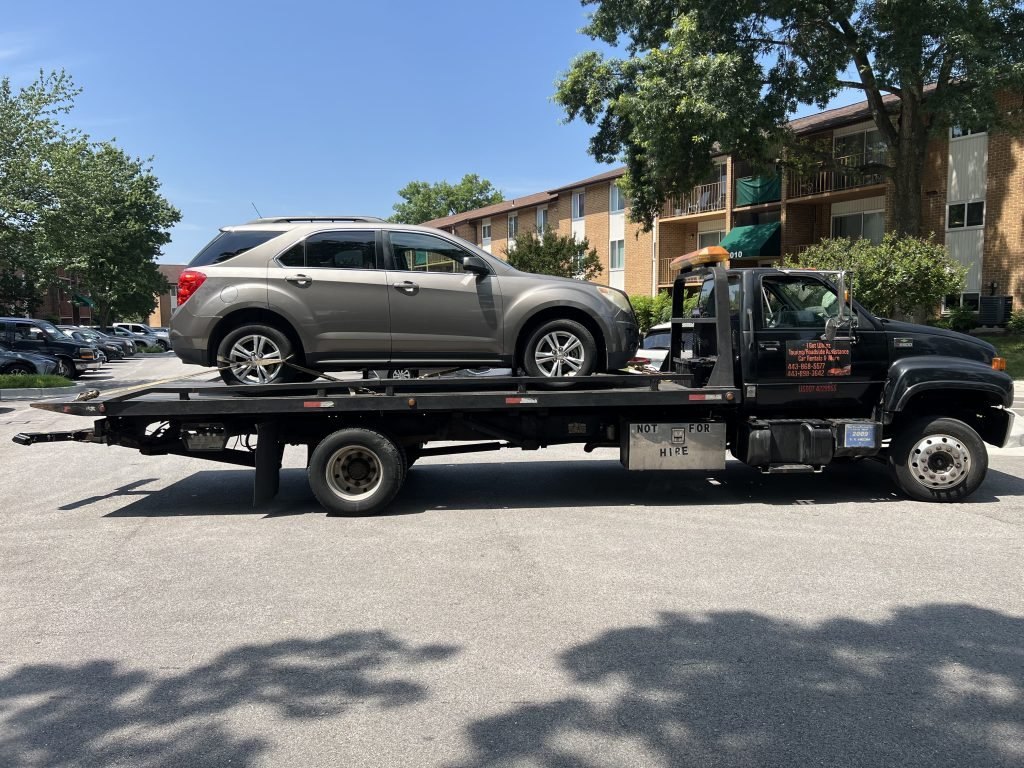 I got Whipz Towing & Roadside Assistance with a beige Chevy Transverse towing near me from 2009 Richglen Dr, Pikesville, MD 21207 to 39.285226, -76.750592