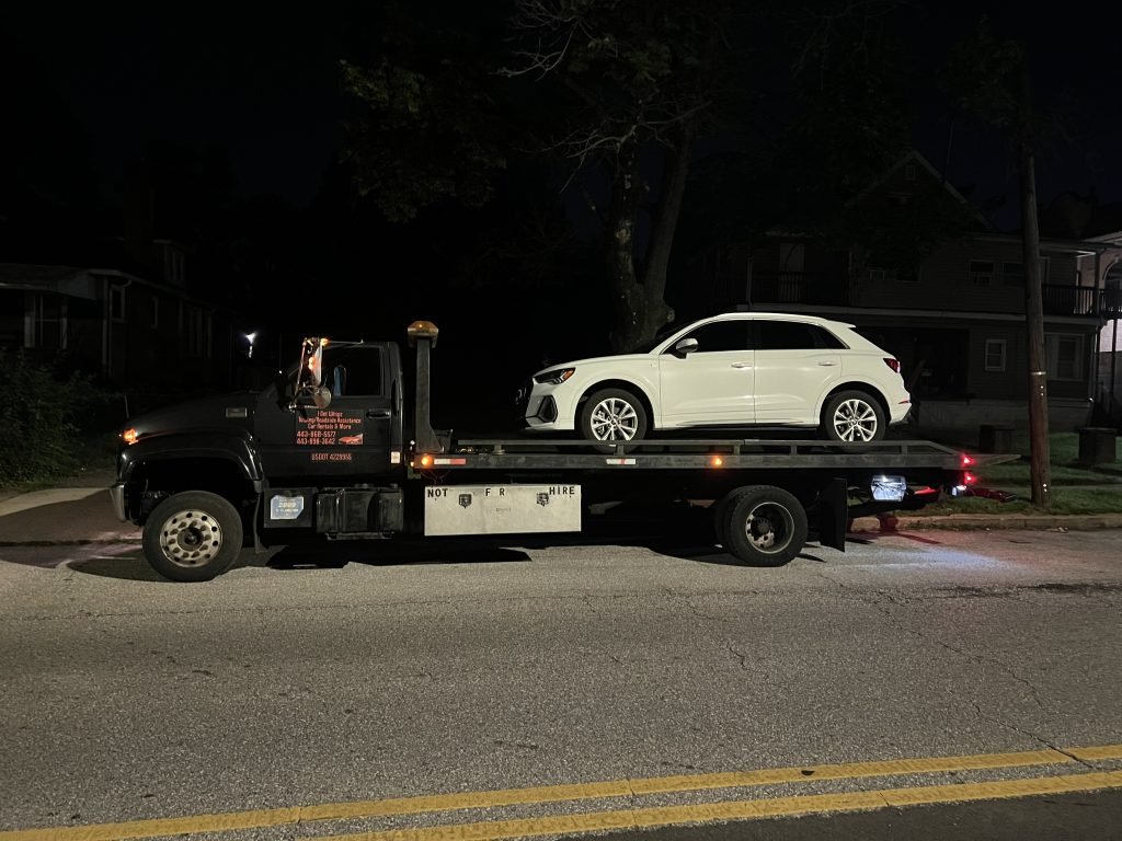 I got Whipz Towing & Roadside Assistance with a white infiniti J30 suv towing near me from 5500 Gwynn Oak Ave, Gwynn Oak, MD 21207 to 5300 Park Heights Ave, Baltimore, MD 21215