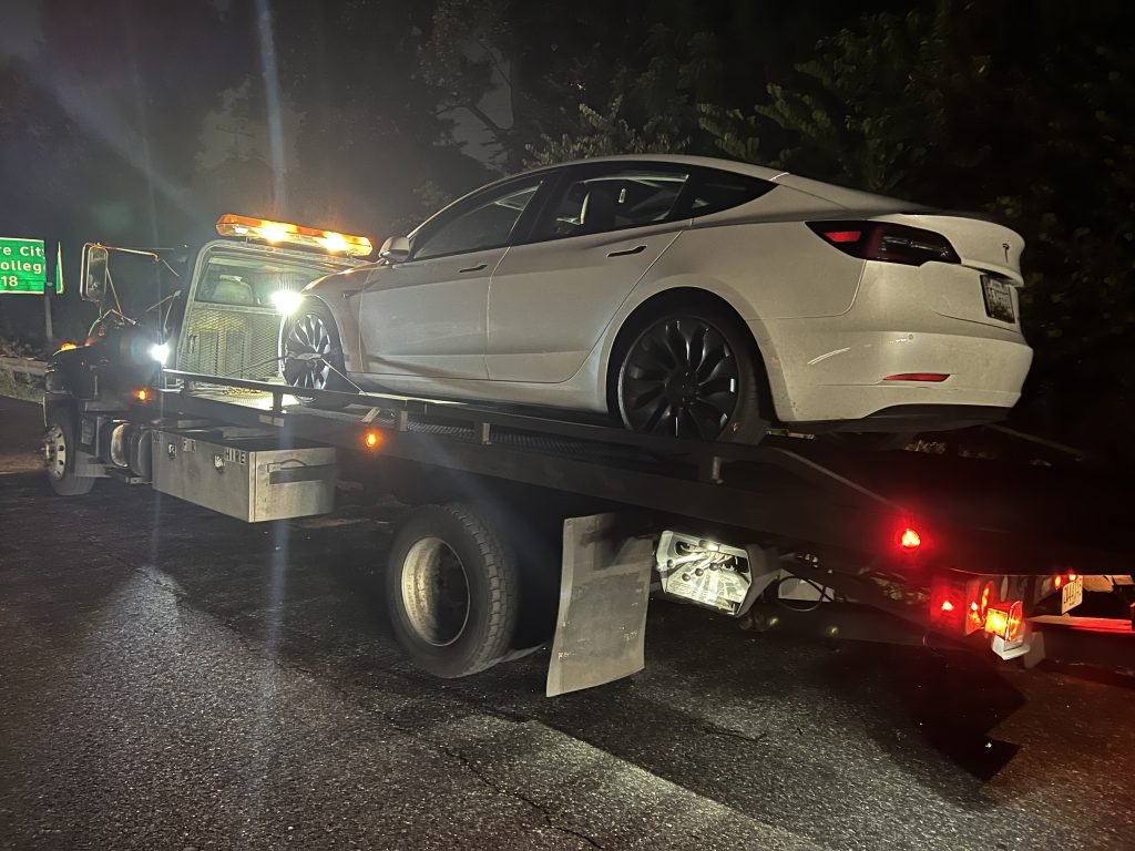 I got Whipz Towing & Roadside Assistance with a white tesla sedan towing near me from 39.334727, -76.744955 to 4700 Bates Dr, Ellicott City, MD 21043