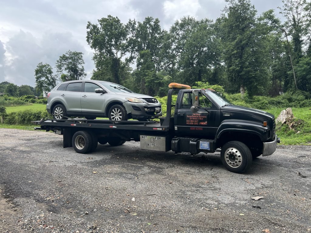 I got Whipz Towing & Roadside Assistance with a silver mazda suv towing near me from 39.214320, -76.688359 to 6824 dogwood rd Woodlawn,MD 21244