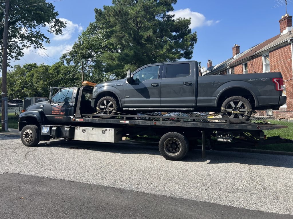 I Got Whipz Towing & Roadside Assistance with a grey F150 xlt truck towing near me from 3000 Ascension st Baltimore,MD 21225 to 803 Eastern Blvd Essex,MD 21221