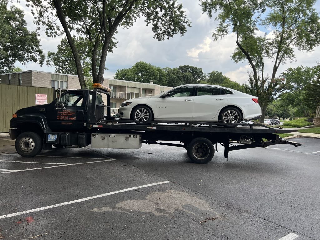I Got Whipz Towing & Roadside Assistance with a white chevy impala towing near me from 7226 Oak Haven Cir, Windsor Mill, MD 21244 to 609 Brisbane Baltimore,MD 21229