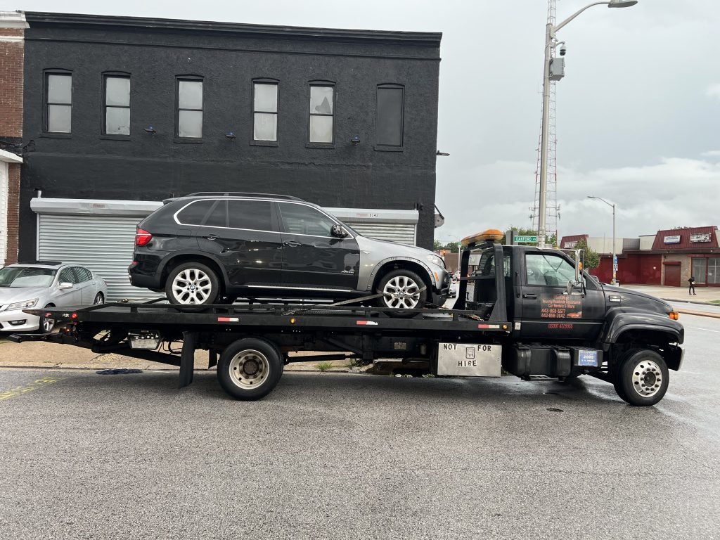 I Got Whipz Towing & Roadside Assistance with a black BMW X5 towing near me from 3199 Oakford Ave, Baltimore, MD 21215 to 575 Lyman Ave, Linthicum Heights, MD 21090