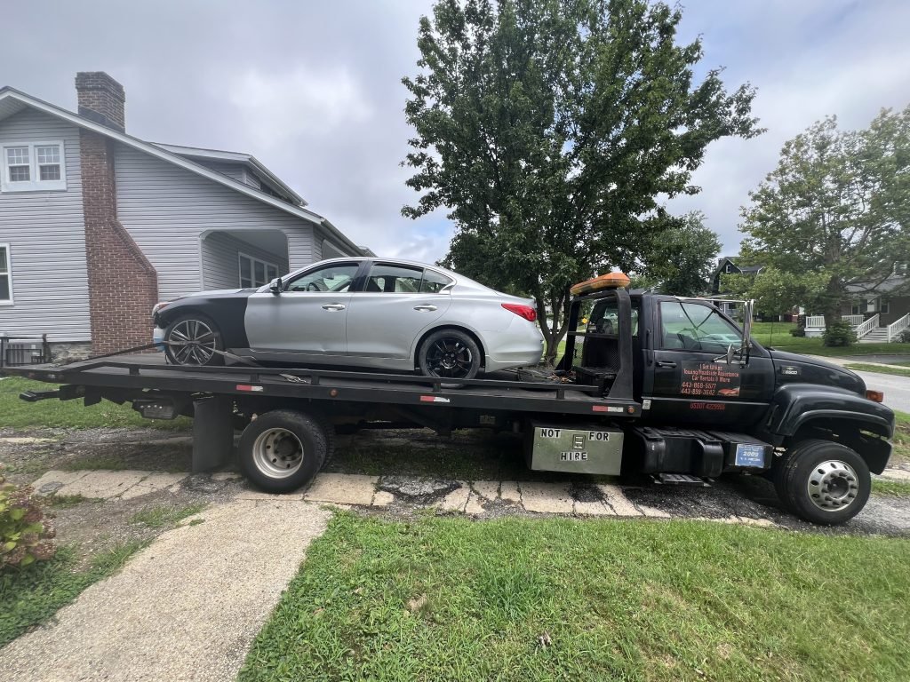 I Got Whipz Towing & Roadside Assistance with a silver infinit Q50 sedan towing near me from 2800 Chelsea Terrace Baltimore,MD 21216 to 5209 Fairlawn Baltimore,MD 21215