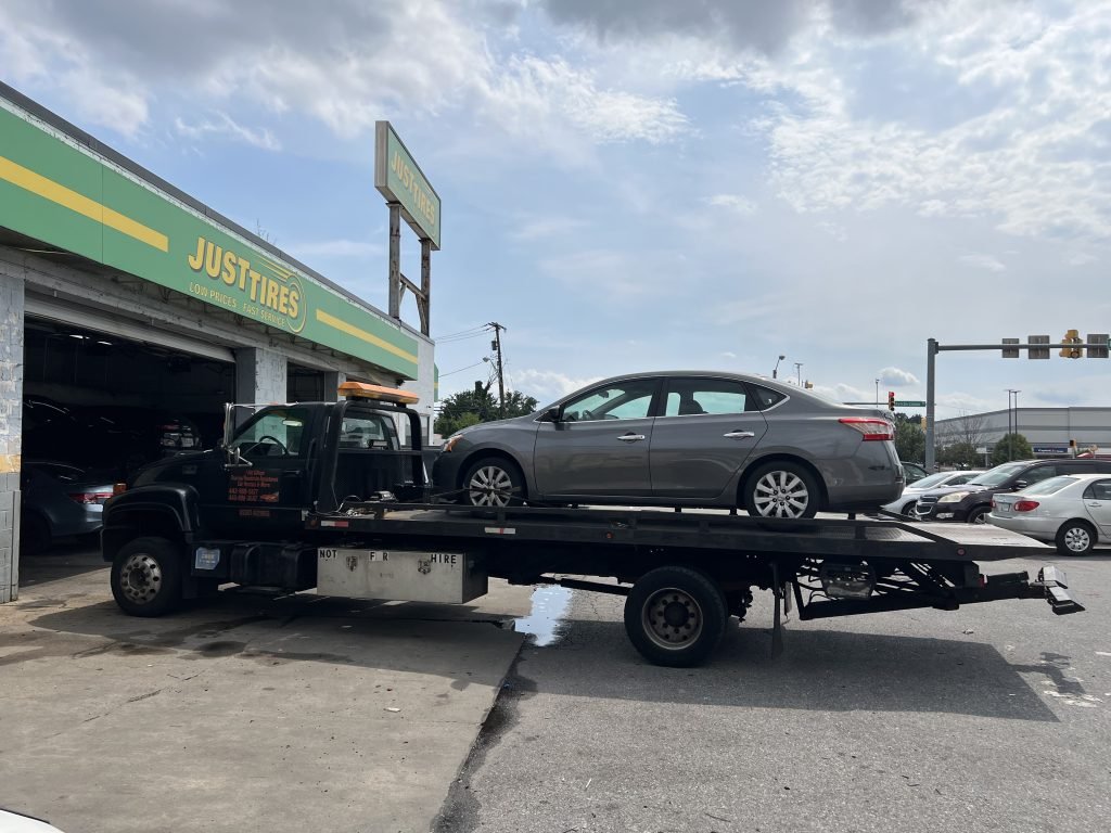 I Got Whipz Towing & Roadside Assistance with a grey Nissan sentra sedan towing near me from 3600 Clarks Ln Baltimore,MD 21215 to 6421 Reiserstown rd Baltimore,MD 21215