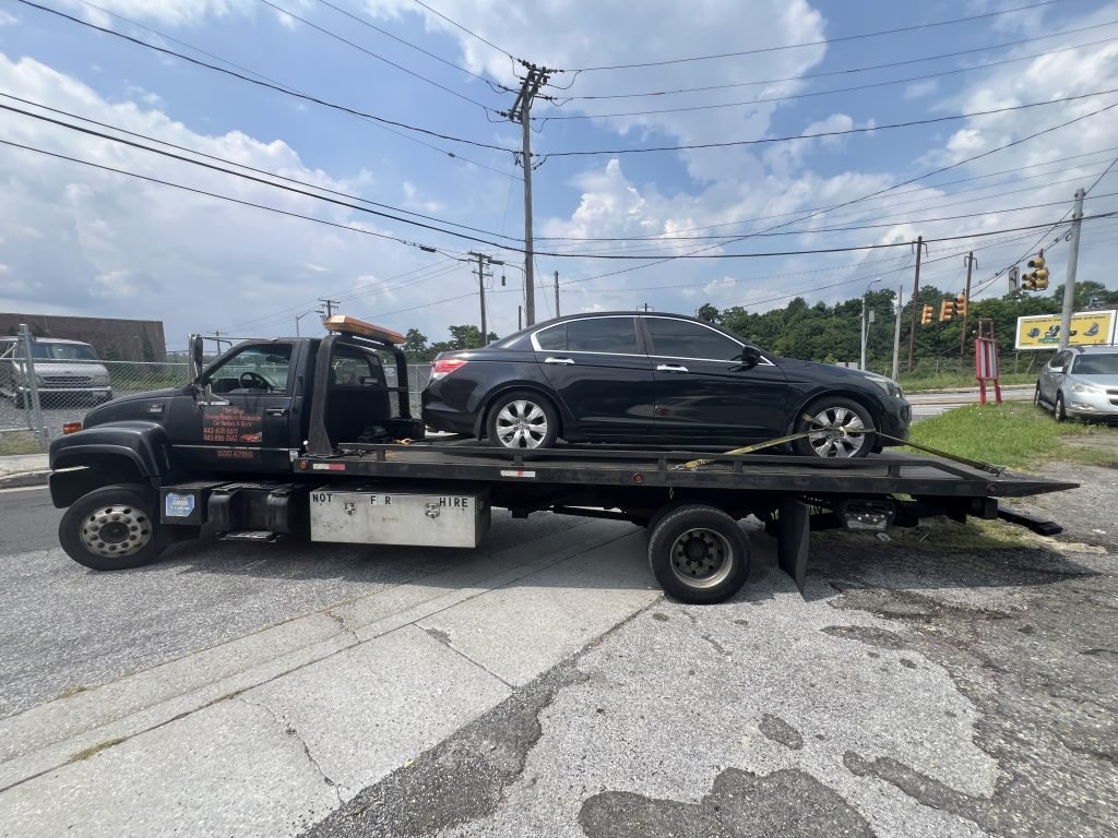 I Got Whipz Towing & Roadside Assistance with a blk Honda Accord sedan towing near me from 319 S Caton Ave, Baltimore, MD 21229 to 3920 Vero Rd L, Arbutus, MD 21227
