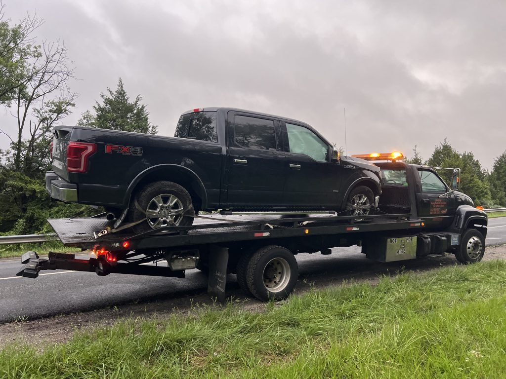 I Got Whipz Towing & Roadside Assistance with a blk Ford F-150 truck towing near me from 39.306863, -76.743250 to 690 Lofstrand Ln, Rockville, MD 20850