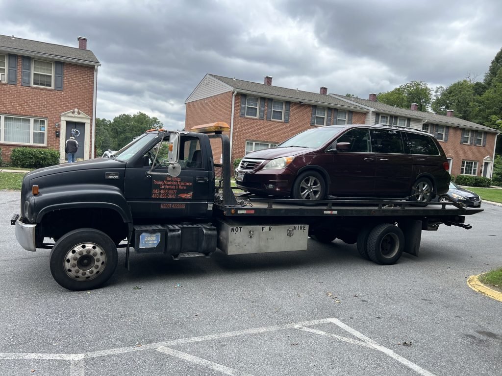 I Got Whipz Towing & Roadside Assistance with a burgundy honda Odyssey van towing near me from 2500 Gatehouse drive Gwynn Oak,MD 21207
